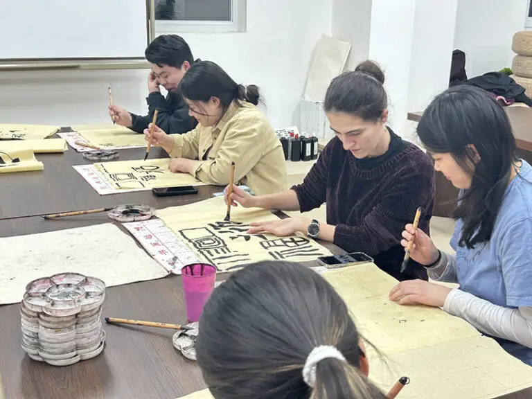 students practicing calligraphy