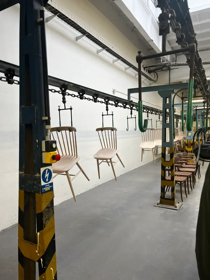Chairs hanging on a line at the Ton chair factory in Brno, Czech Republic