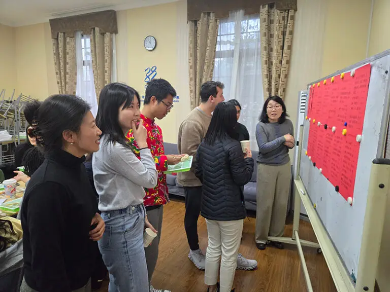 students in classroom looking at board