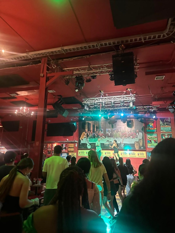 People on the dance floor at a salsa club called La Topa in Colombia