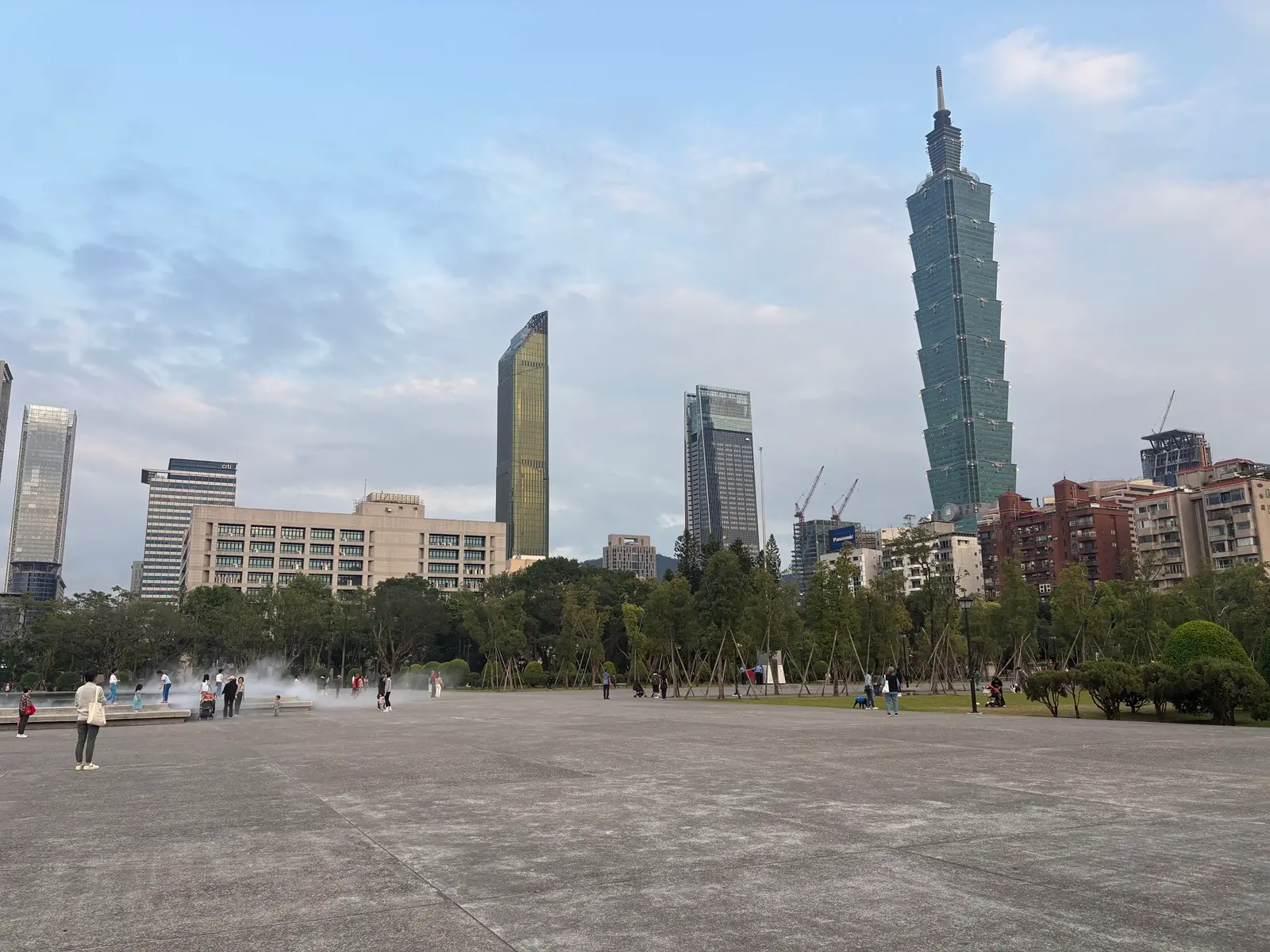 Panoramic views of the city skyline coupled with all of the people out at Zhongshan park in Taiwan.