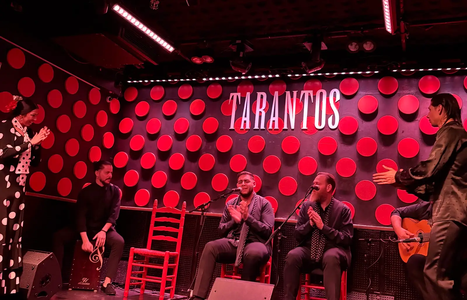 Two artists and musicians in a flamenco show