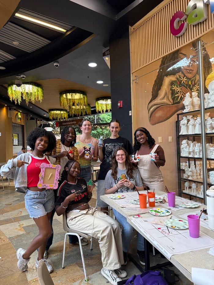A group of CET Colombia students and friends in a painting class