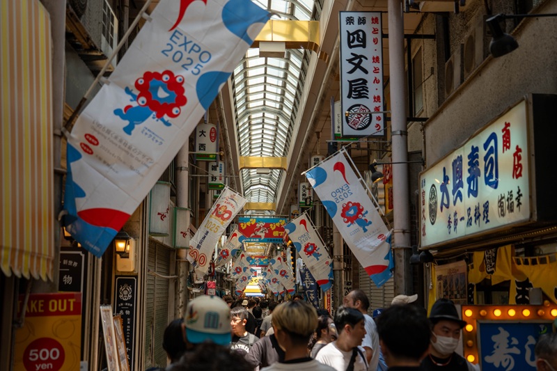 The Janjan Yokocho shopping street in Osaka, famously decorated with flags for the upcoming Expo 2025.