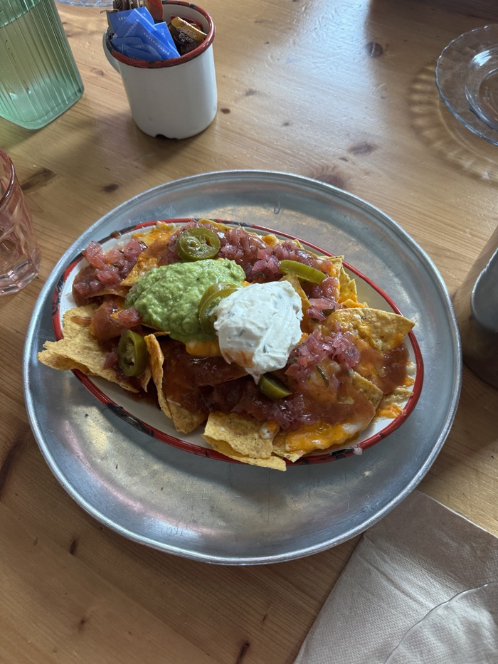 A tapa dish of nachos on a dish
