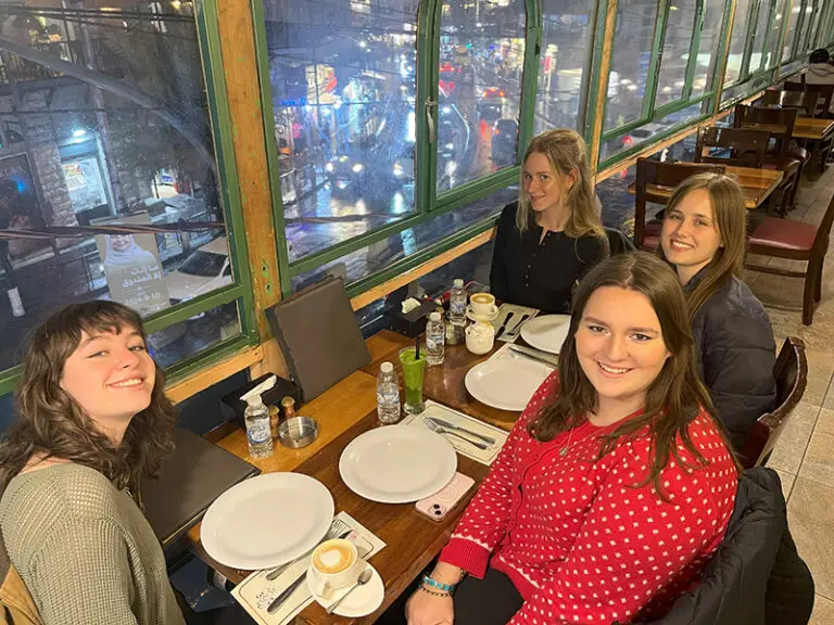 students and language partners at lunch