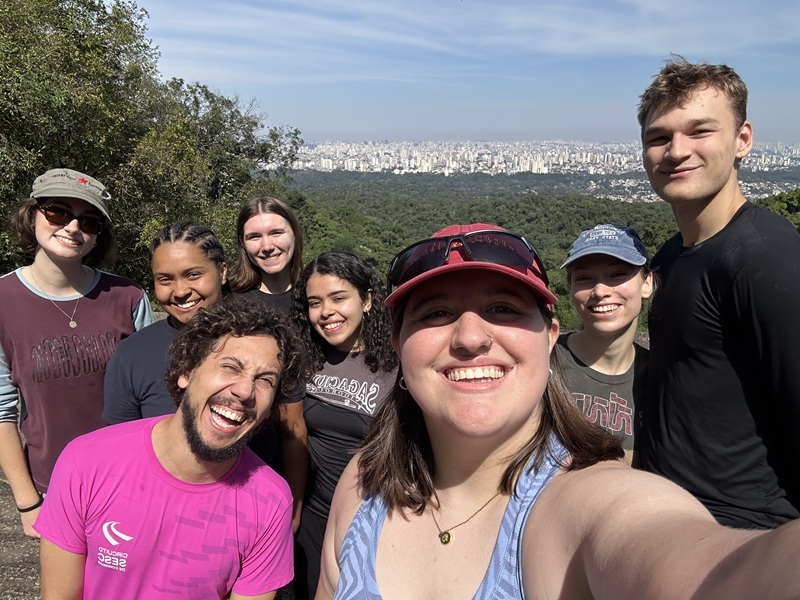 A group selfie of CET Brazil students while they're on a hike at the Pedra Grande Trail