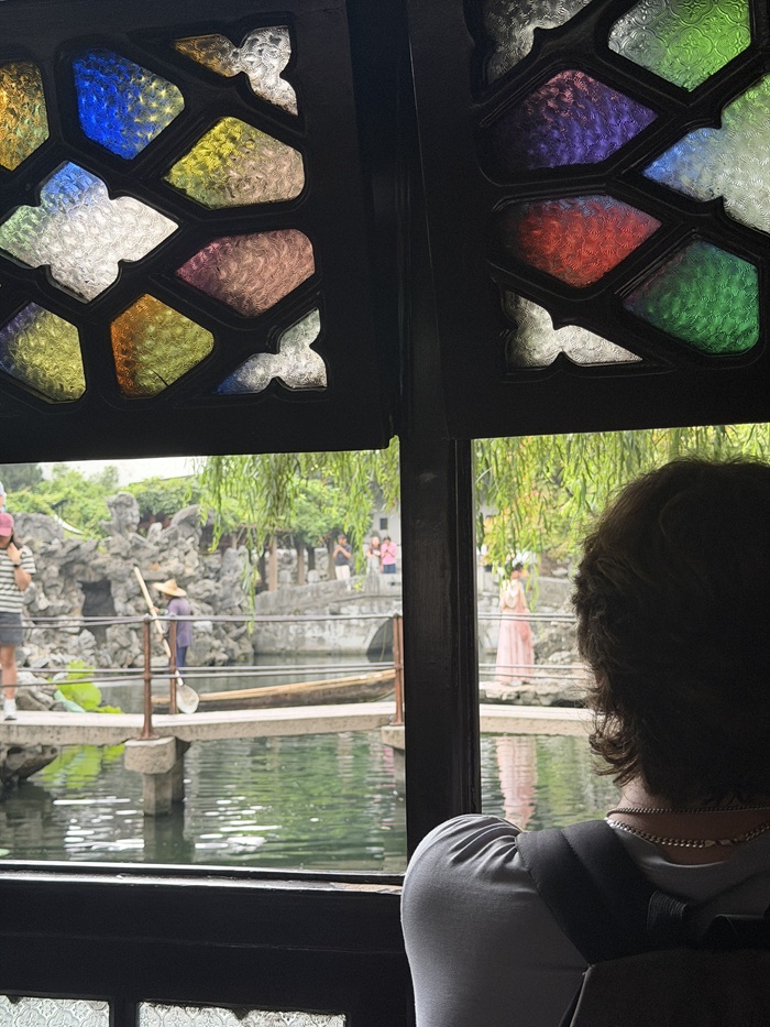 View through colorful windows overlooking a traditional garden