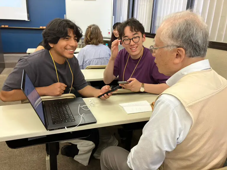 students practicing language development by talking with local